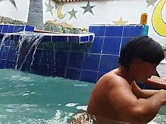Indian mature and young Brazilian couple in the pool