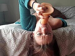 Petite homemade video of mature woman gagging on dildo upside down