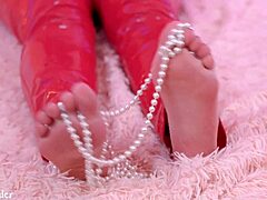 Closeup of Arya grander's Big Feet in BDSM Video